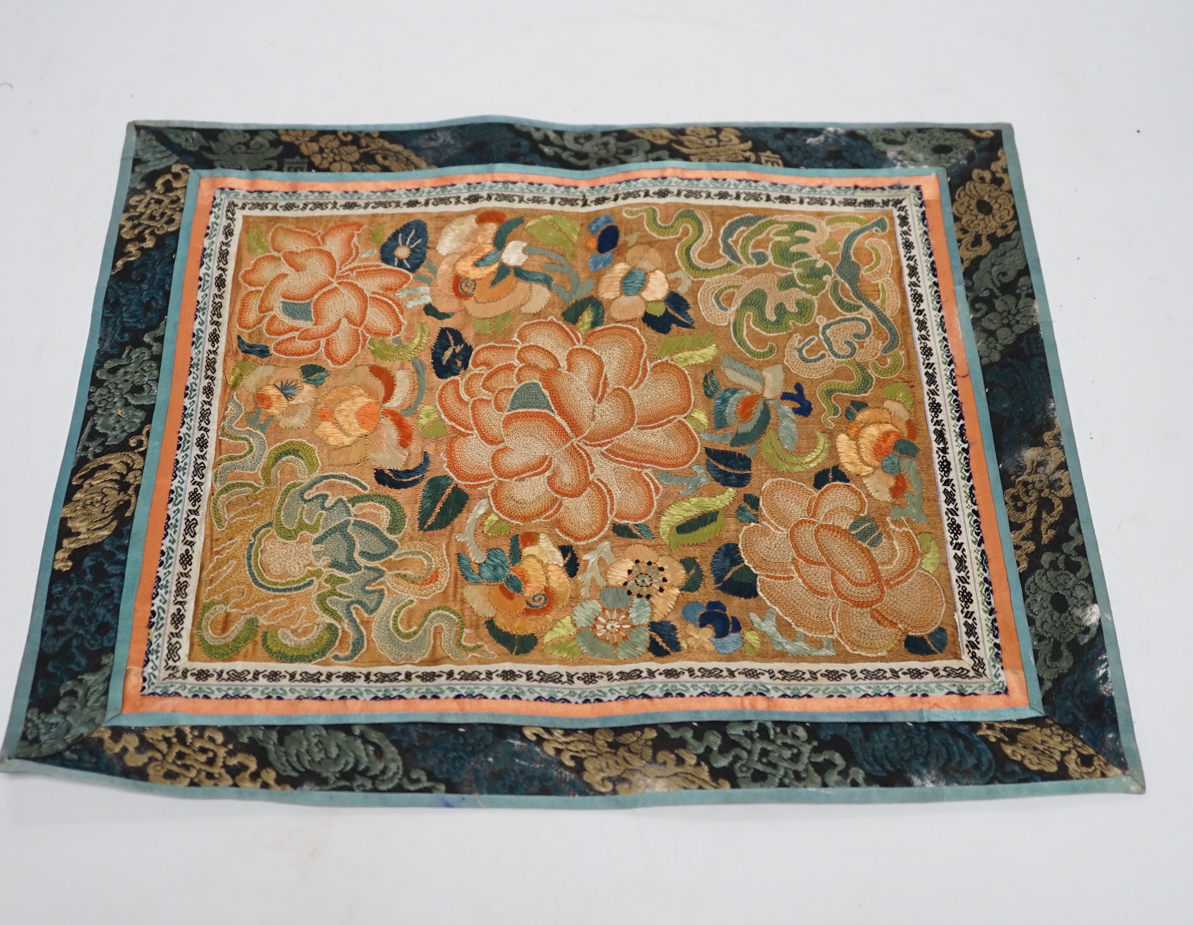 Six panels of Chinese silk embroidered mats, all using mixed stitches including Beijing knot, all bordered with silk brocade, largest 36 x 41cm